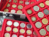 a red box filled with different types of coins