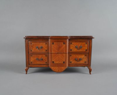 a wooden dresser with four drawers and two doors
