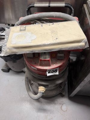 an image of a vacuum cleaner with a box on top of it