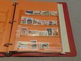a red binder with stamps on it and a red binder with stamps on it