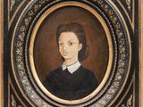 portrait of a young man in a black dress and white collared shirt