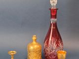 several pieces of glass and gold on a blue background