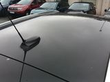 many cars parked in a parking lot next to each other