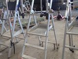many ladders that are sitting in a building