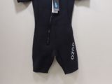 a baby boy ' s wetsuit and a pair of sunglasses on a table
