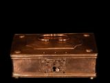 a metal box with a handle on a black background