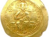 an image of a gold coin with an image of jesus on it