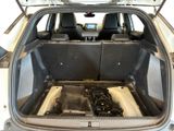 the back of a car with its trunk open showing the inside of the vehicle