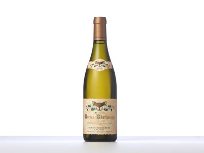 the bottle of white wine is sitting on the table