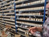 a man that is standing in front of some shelves