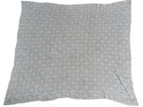 a grey pillow with a diamond pattern on it