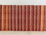 a stack of old books sitting on top of each other