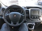 steering view of a car with a person sitting in the driver ' s seat