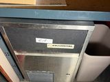 a box that is sitting on the floor next to a trash can