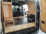 a van that has a bed in the back of it