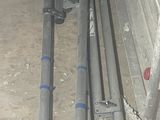 a pile of metal pipes sitting on the ground