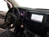 dashboard view of a car with a steering wheel and dashboard controls