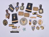 a lot of pins and badges on a white surface