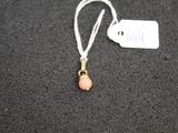 a small necklace with a pink bead on it