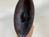a person holding a metal object in their hand