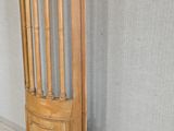 a wooden door that is leaning against a wall