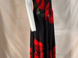 a woman ' s black and red dress with roses on it