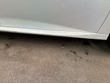 a white car parked on the side of the road