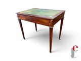 an image of a small wooden table with a green top
