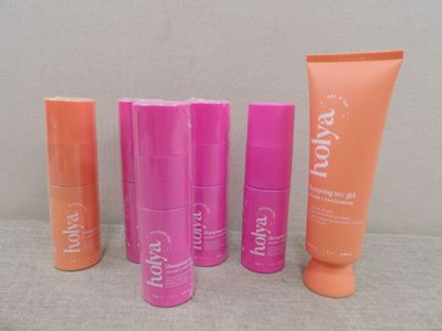 four different types of body lotion products sitting on a table