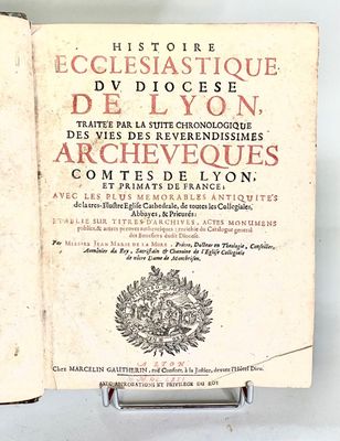 an old book that is open on a table