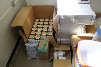 a box of cups and a box of boxes in a room