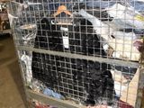 a cage with a dog inside of it in a warehouse