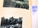 an open book with a picture of a farm in it