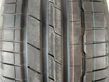 a close up of a tire on a stand with a white background