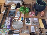 a table with many items on it including scissors, pens, scissors, and other items