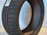 a close up of a tire on a white surface