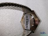 a person holding a watch with a barcode on it