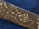 a knife that is laying on top of a blue cloth
