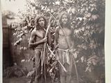 an old black and white photo of two men standing next to each other