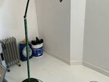 a desk with a lamp on top of it in a room
