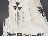 a close up of a baseball glove with a baseball cap on top of it