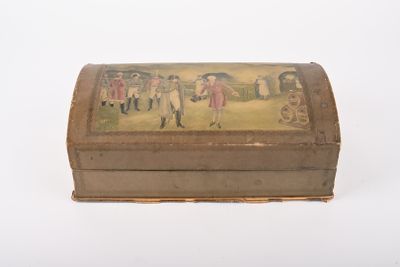 une petite boîte avec un tableau sur une surface blanche