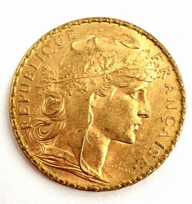 l'image d'une pièce d'or sur laquelle figure une tête de femme