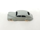 a toy car that is sitting on a white surface