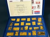 an open blue case with stamps and stamps in it on a table