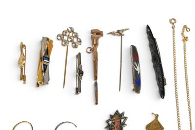 many different types of jewelry on display on a white surface