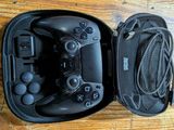 a black case with two controllers inside of it on a table