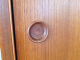 a close up of a wooden door with a knob