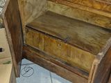 a wooden bench that is sitting in a room