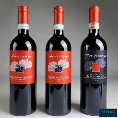 trois bouteilles de vin rouge posées côte à côte sur une table